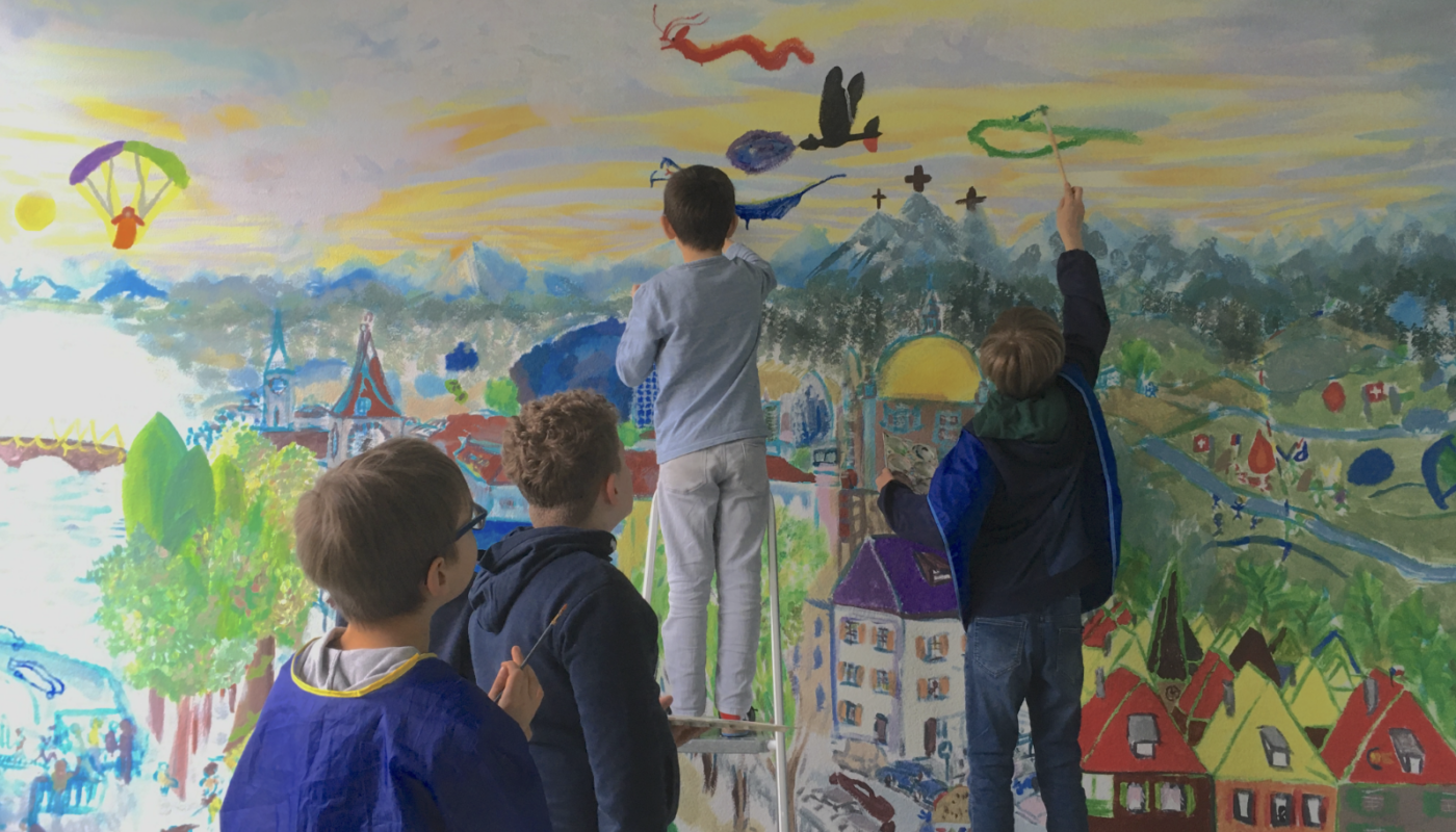 Maltag Kinder malen ein Wandbild